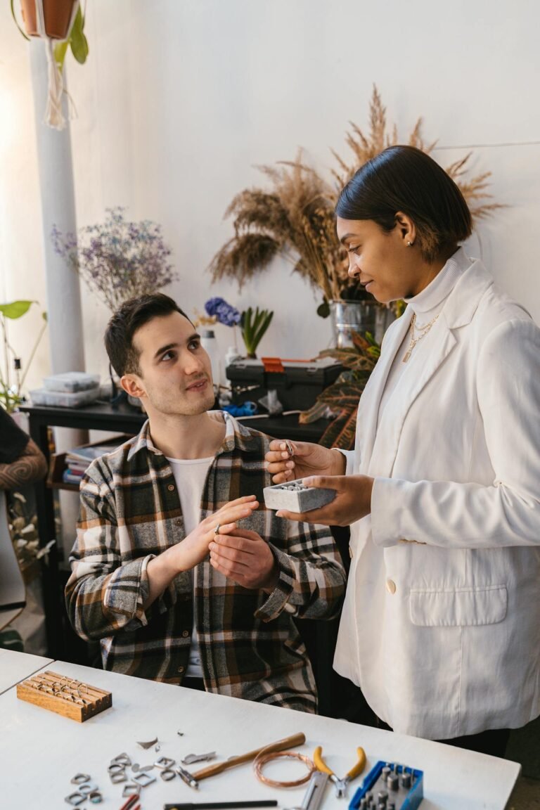 Two individuals engaged in a collaborative workspace, sharing ideas and tools.